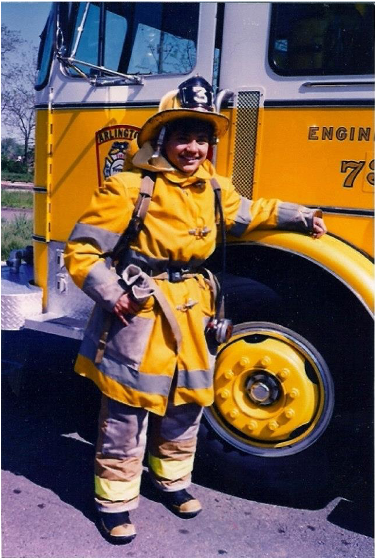 Catie Drew pictured in turnout gear with Engine 73.